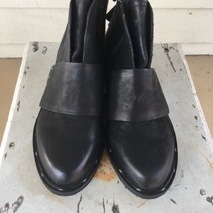 Leather low cut black boots.